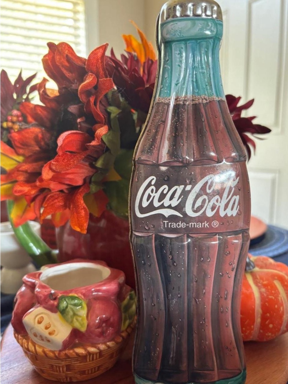 Vintage 1997 Coca-Cola bottle tin with condensation effect.